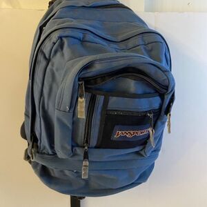 Blue Jansport hiking large hardback backpack waist strap